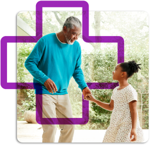 Grandfather and granddaughter holding hands